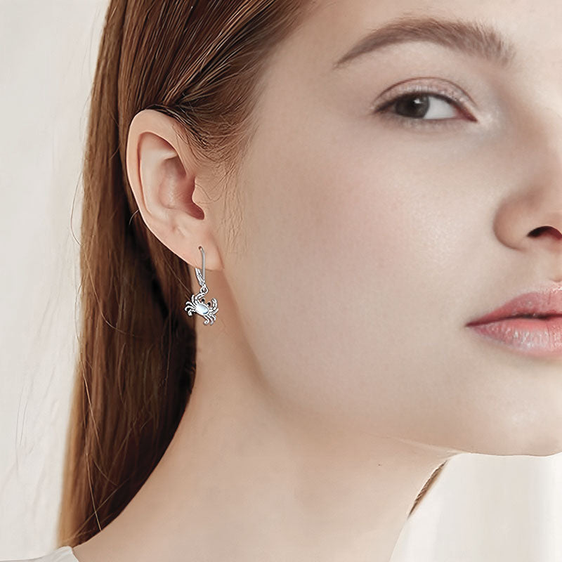Origsoul 925 silver crab earrings showcasing a stylish design on a model's ear