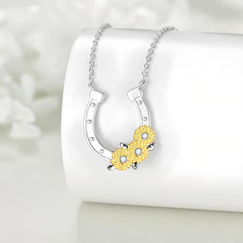Origsoul lucky horseshoe necklace with silver chain and yellow flower accents on white background