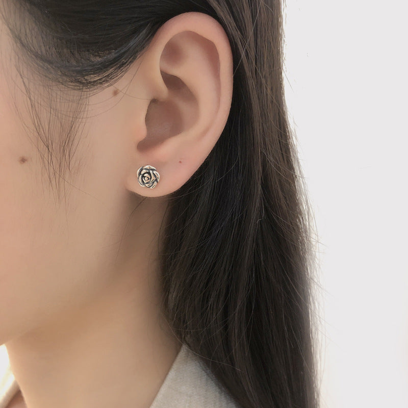 The primary June birth flower rose flower earrings