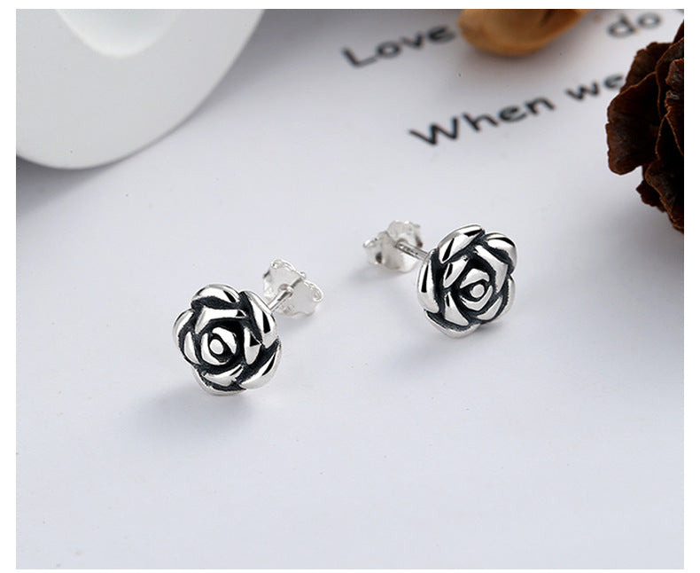 The primary June birth flower rose flower earrings