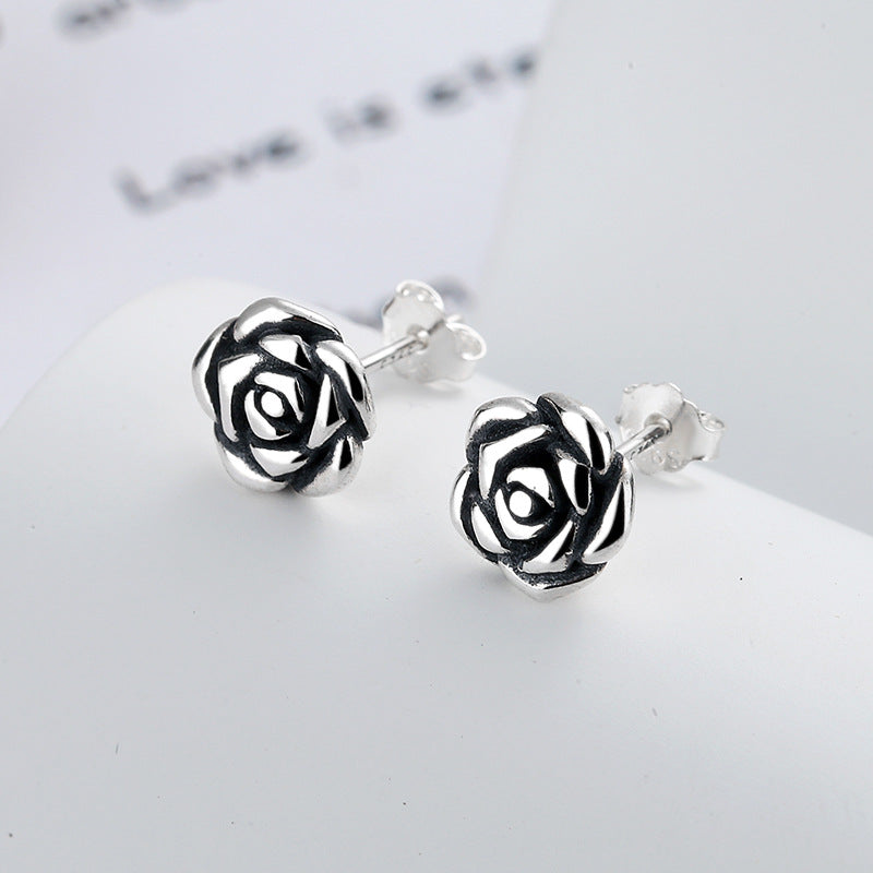 The primary June birth flower rose flower earrings