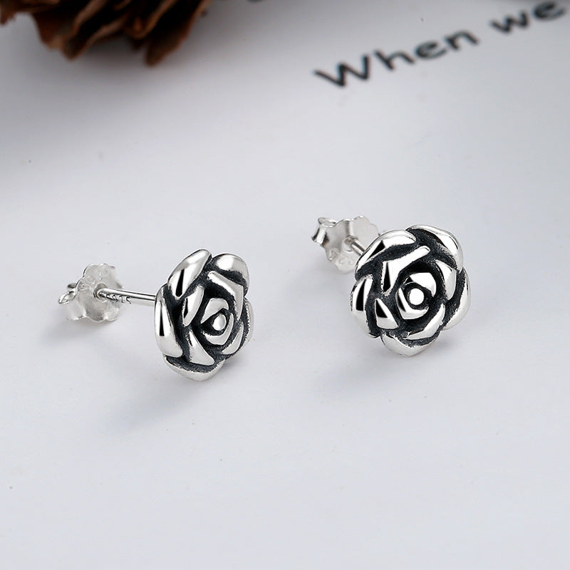 The primary June birth flower rose flower earrings