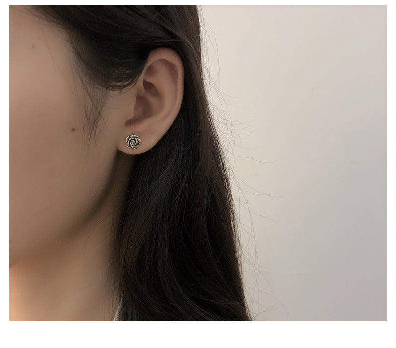 The primary June birth flower rose flower earrings