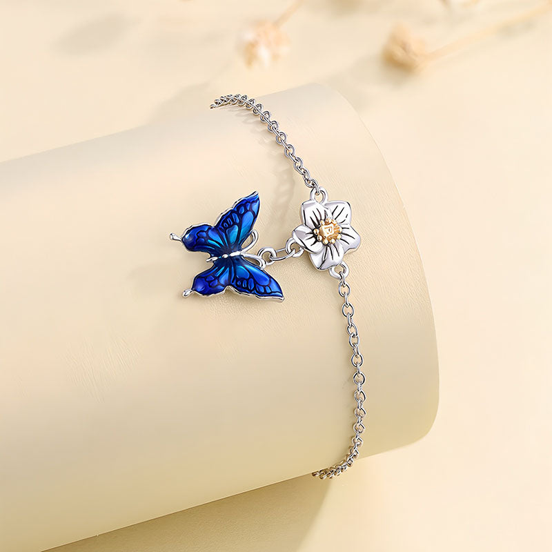 Origsoul blue butterfly bracelet with silver chain and flower charm
