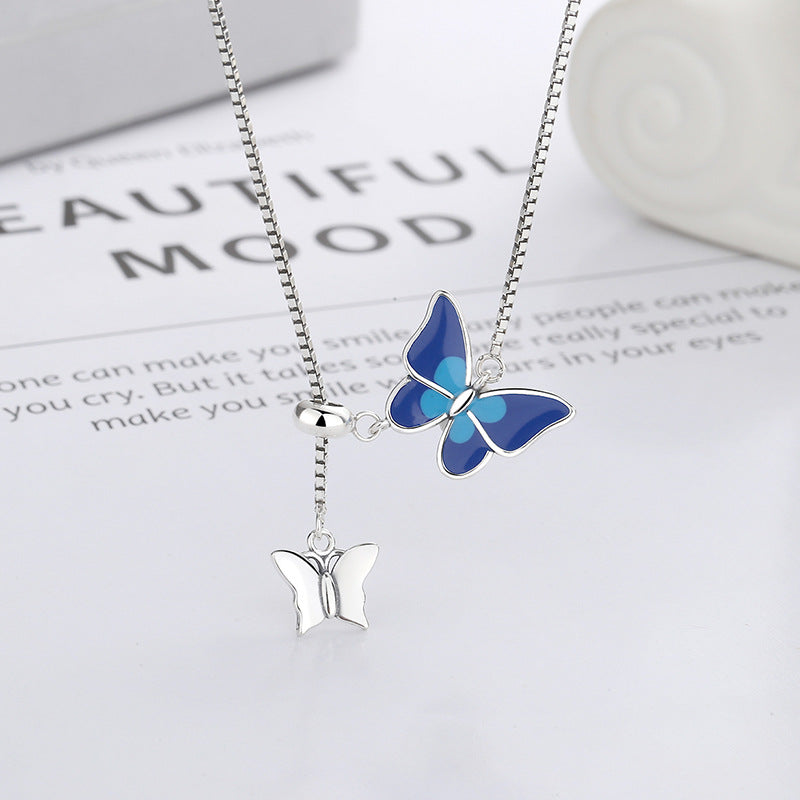 Origsoul delicate butterfly pendant jewelry featuring blue and silver butterfly charms on a silver chain