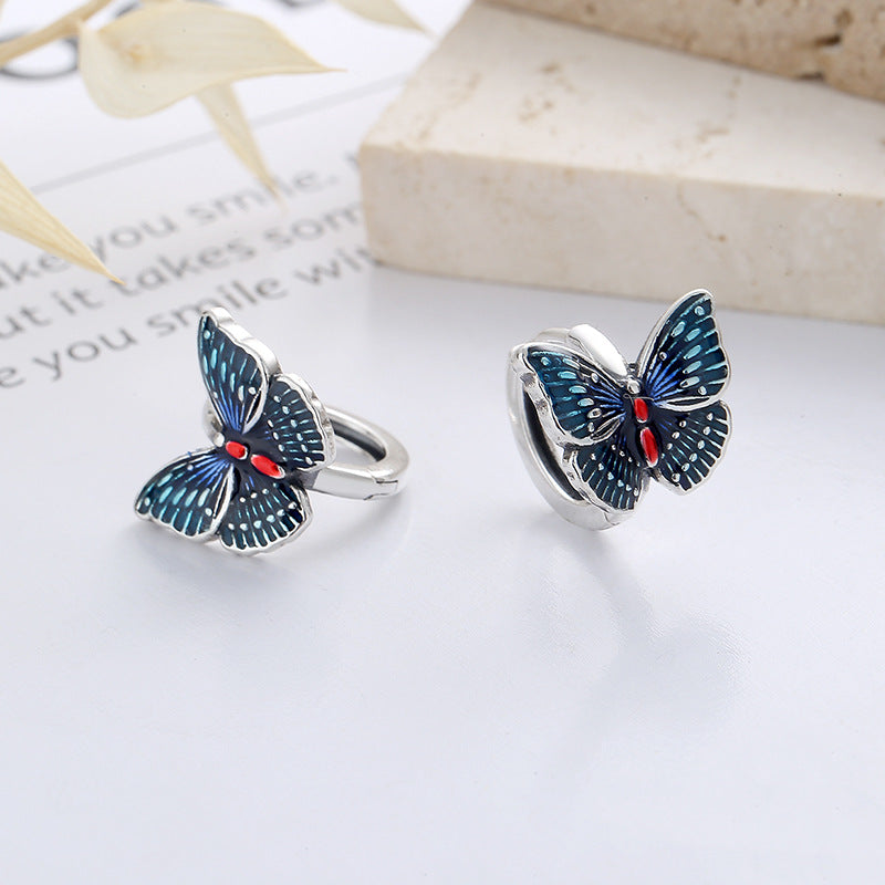 Origsoul butterfly earrings for women featuring blue and black enamel design with red accents