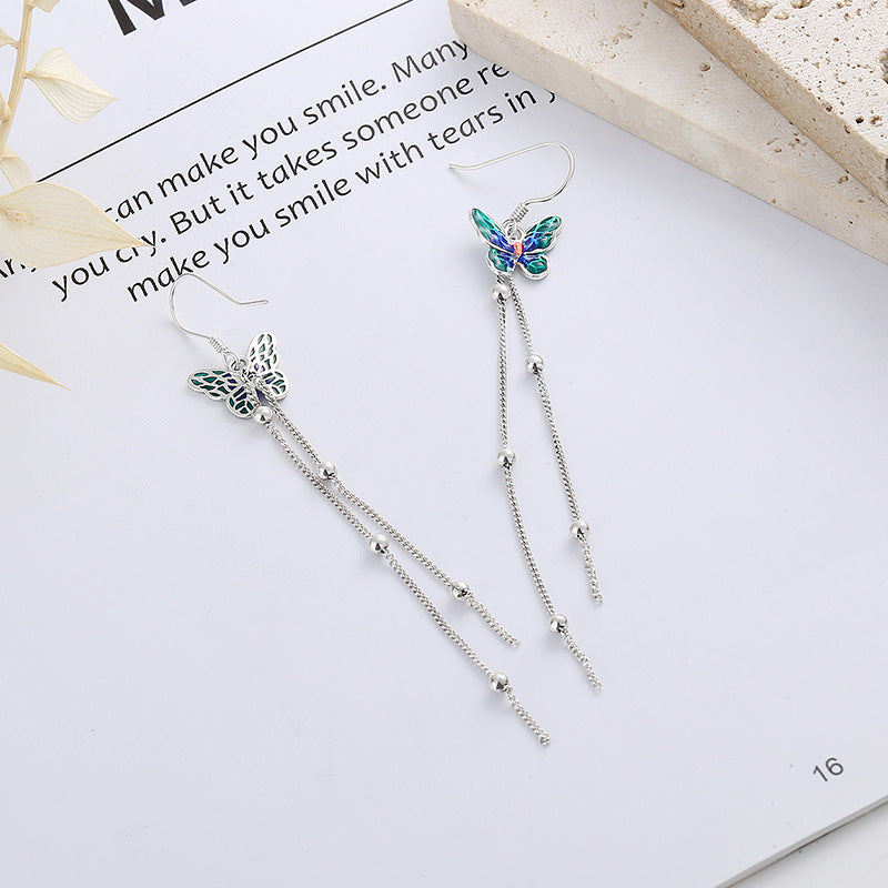 Origsoul butterfly tassel earrings with silver chains and colorful butterfly design on white background