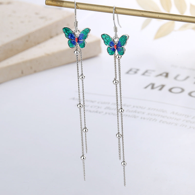 Origsoul butterfly tassel earrings with green and blue enamel butterfly charms and silver dangling chains