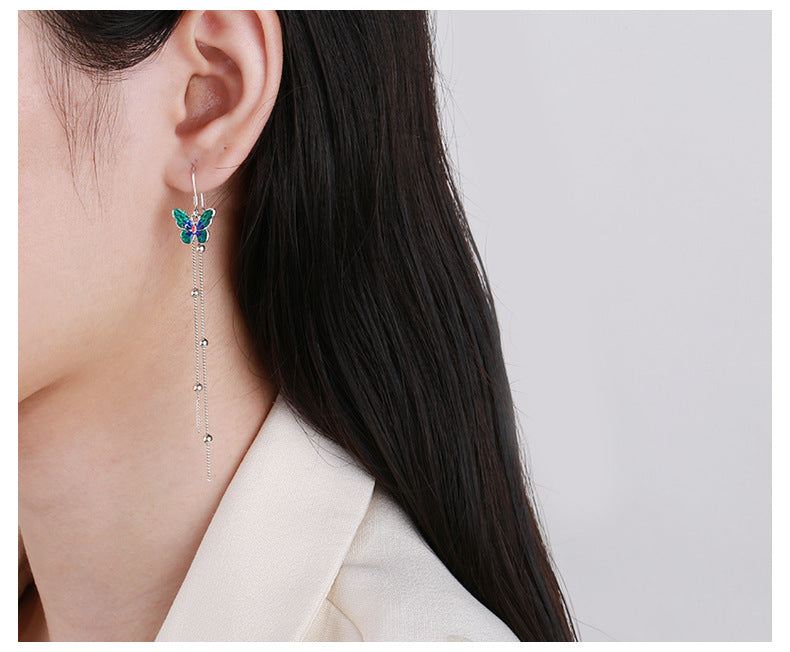 Origsoul butterfly tassel earrings with delicate blue and green butterfly and silver chain tassels