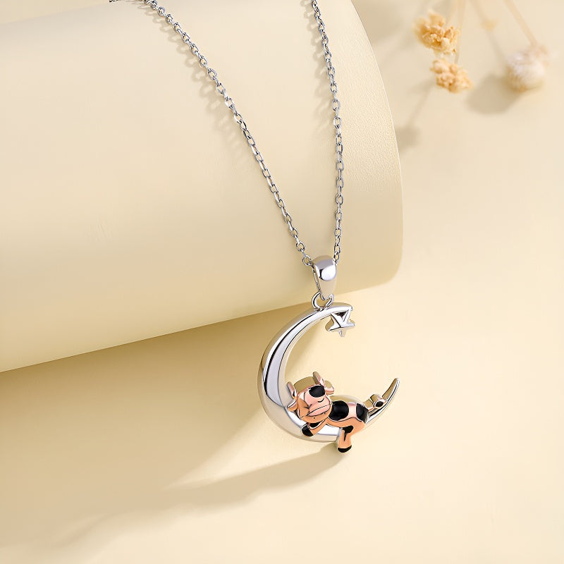 Cartoon cow moon pendant necklace with a playful cow design and silver chain, perfect for casual wear