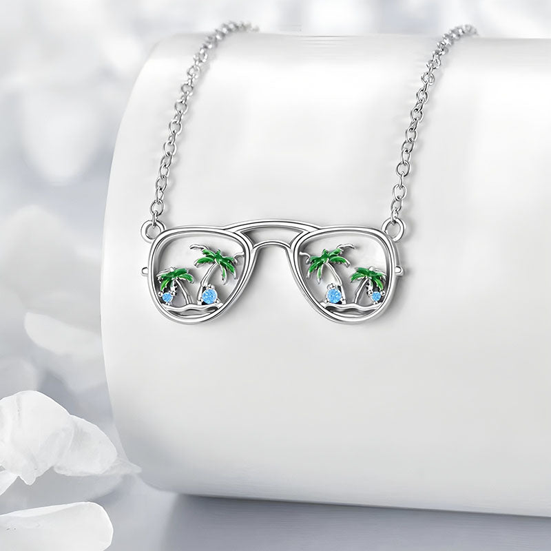 Origsoul silver beach sunglasses necklace with palm tree and blue stone detailing