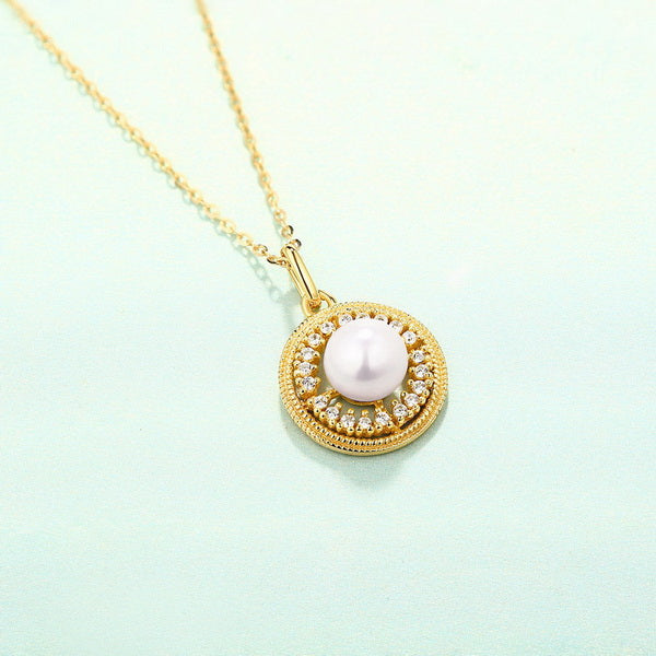 Origsoul freshwater pearl necklace with gold chain and round pendant studded with crystals