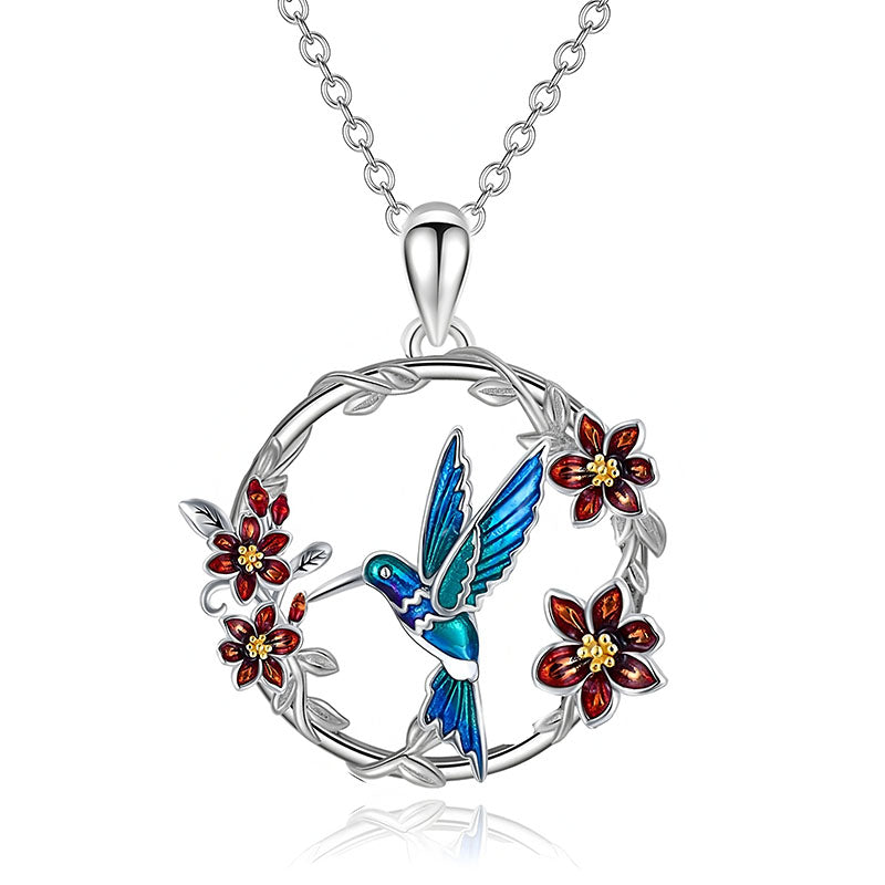 Origsoul hummingbird floral necklace with blue hummingbird and red flowers on silver chain