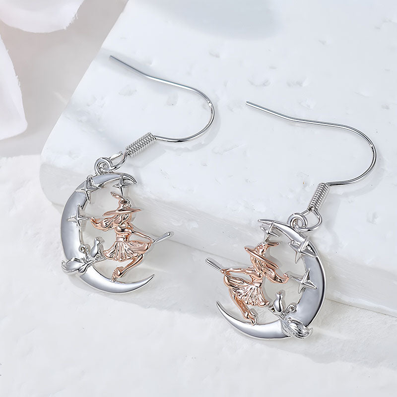 Origsoul crescent moon dangle earrings with witch design in silver and rose gold tones
