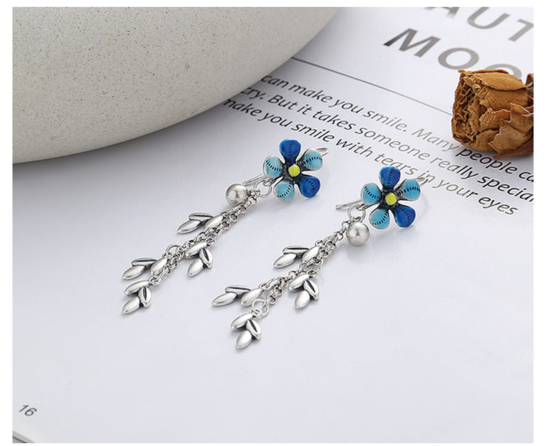 Origsoul daisy tassel earrings with blue flower petals and silver leaf tassels