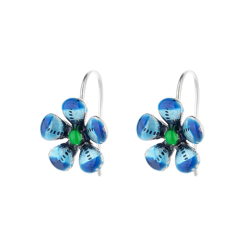 Origsoul daisy tassel earrings with blue petals and green center in birthflower jewelry design