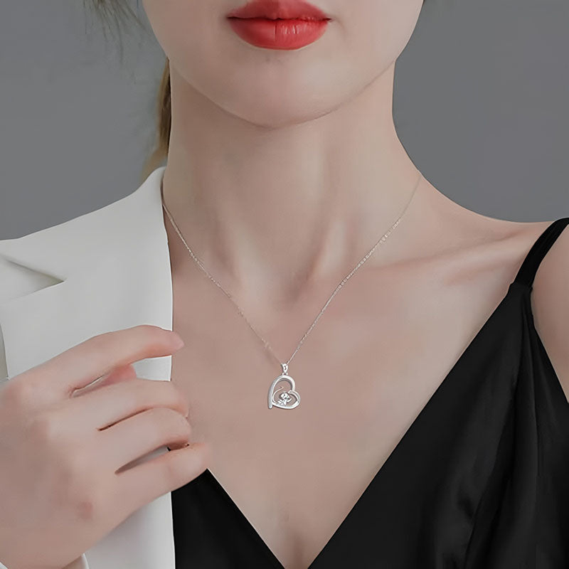 Origsoul 925 sterling silver monkey pendant heart charm necklace displayed on model wearing black top and white blazer