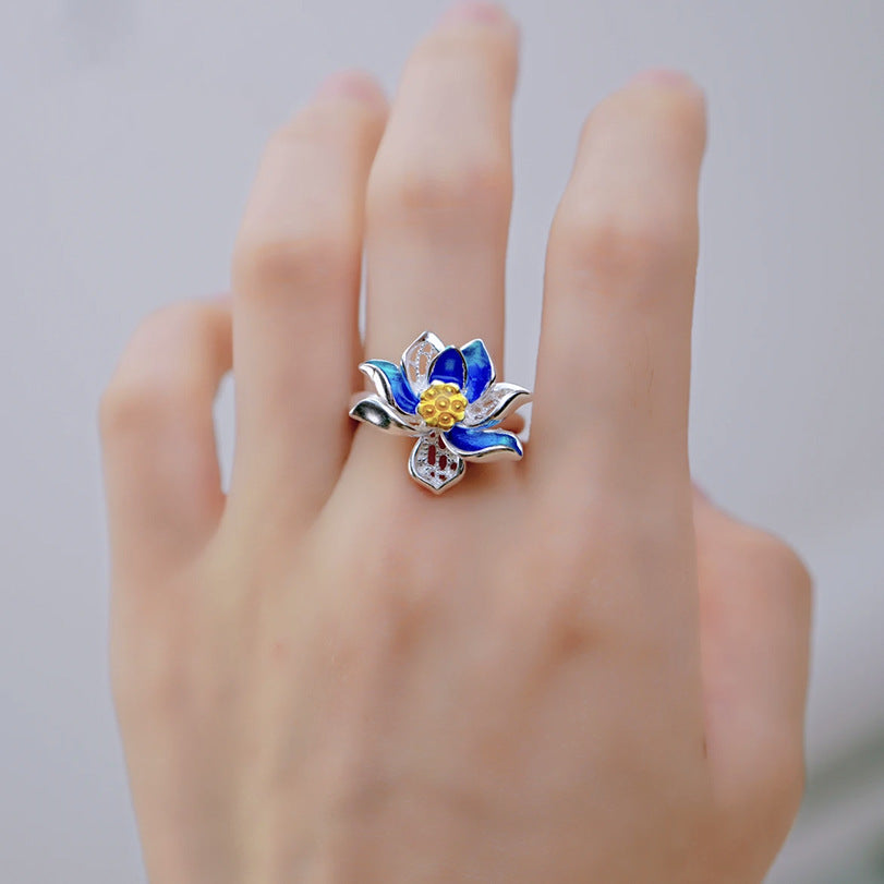 Origsoul March birth flower ring featuring a blue and silver floral design on a hand