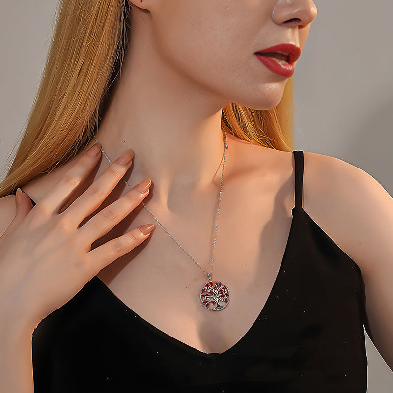 Origsoul triple color tree of life necklace worn by woman in black top with red lipstick