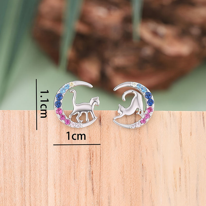 Origsoul moon cat zircon stud earrings shown with detailed silver cross necklace jewelry