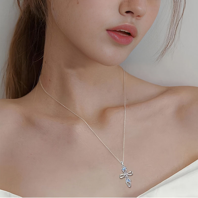 Origsoul ocean cross pendant necklace worn by woman with delicate silver chain and detailed cross design