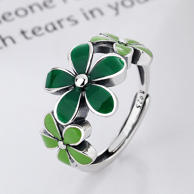 Origsoul October birth flower ring with silver band featuring green enamel flower designs