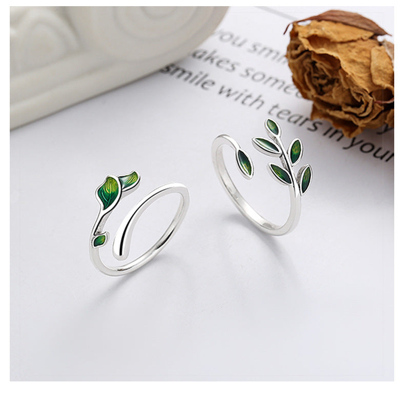 Origsoul silver olive leaf ring with green enamel detailing on a white background