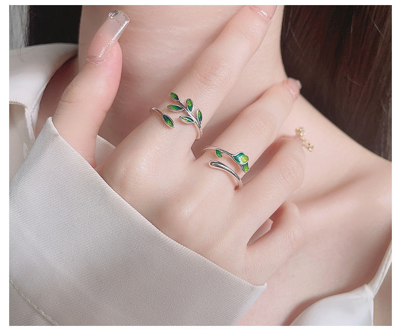 Origsoul olive leaf ring with green enamel leaves worn on finger showcasing delicate jewelry design