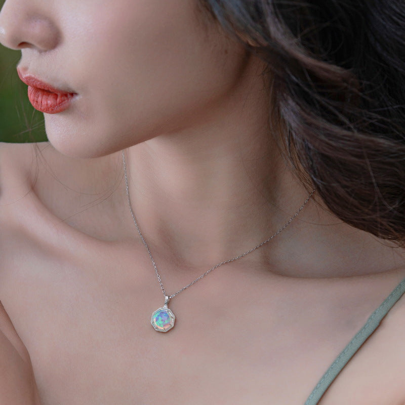 Elegant opal pattern silver jewelry necklace by Origsoul worn on woman's neck