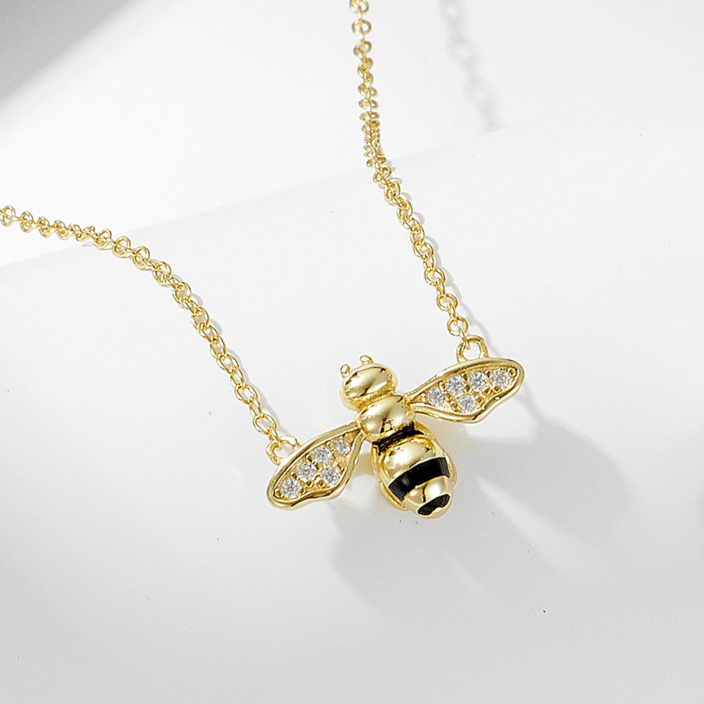 Origsoul gold bee necklace featuring painted oil drop jewelry design with crystal wings