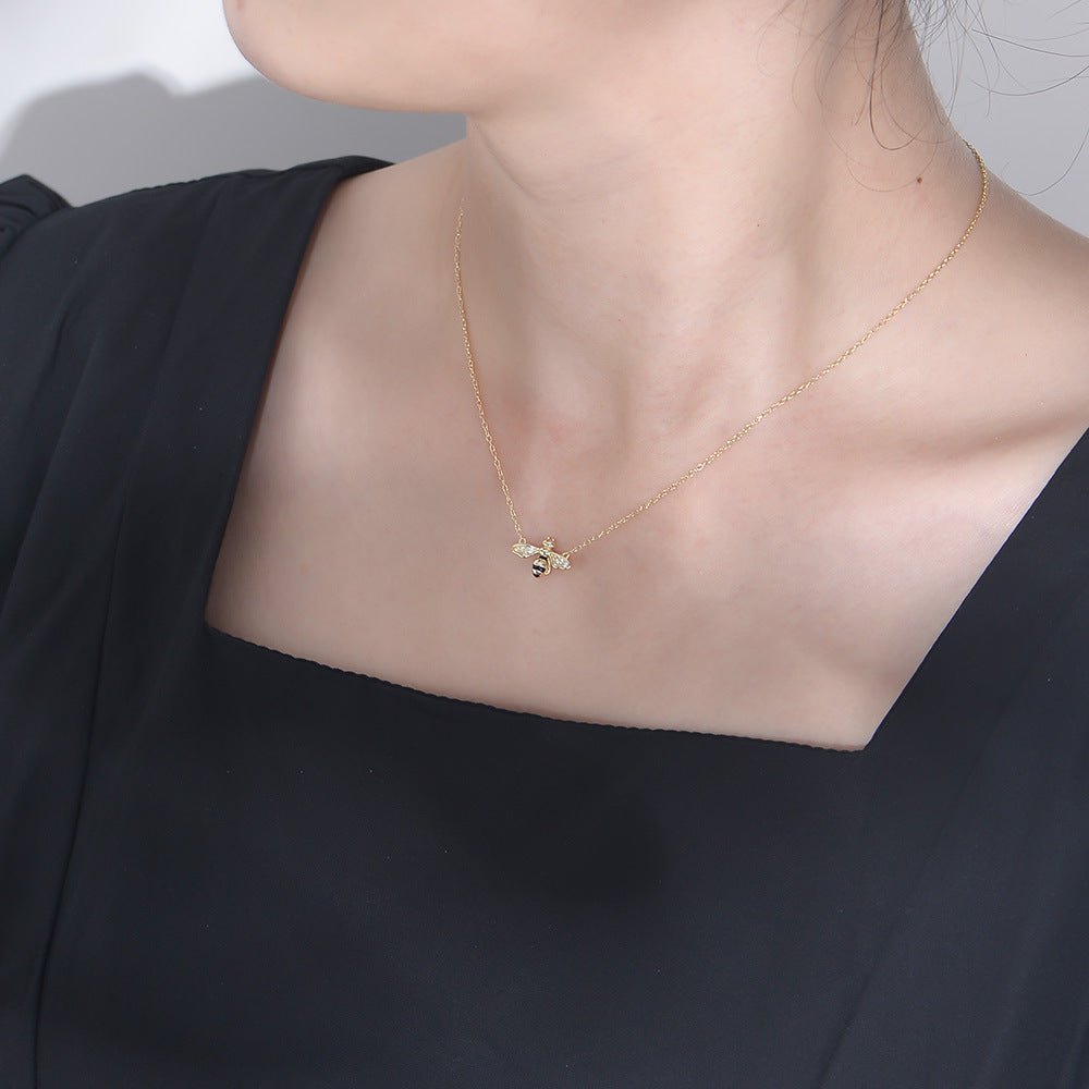 Origsoul insect necklace featuring painted oil drop jewelry on a delicate gold chain