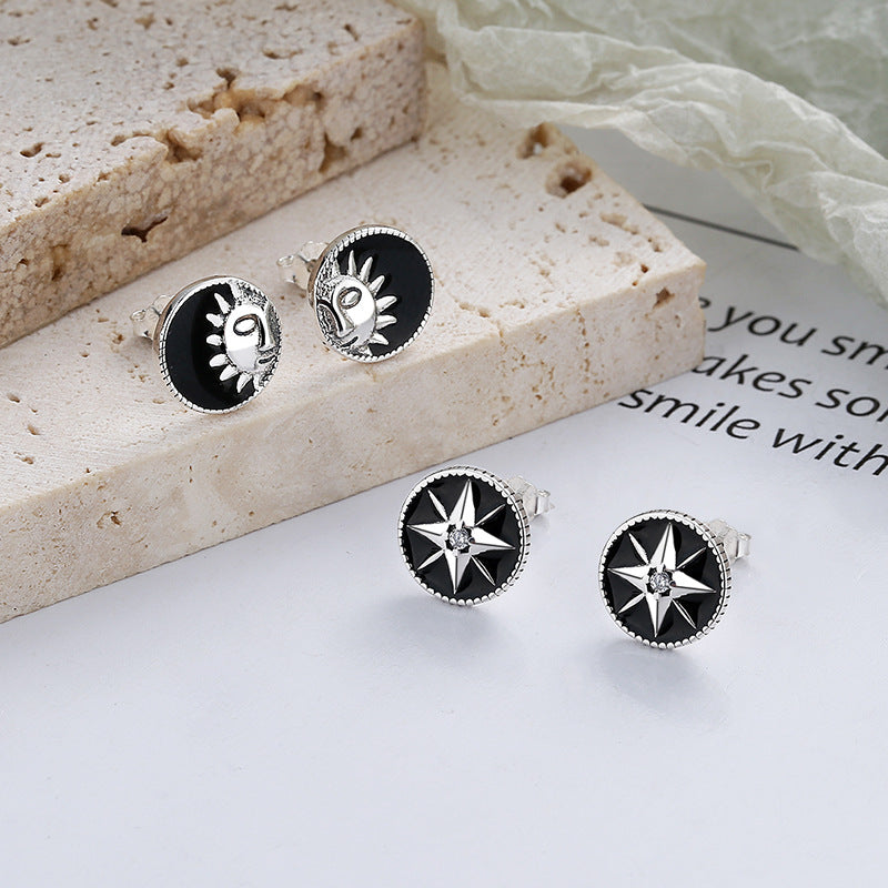 Origsoul retro black enamel earrings featuring cosmic sun and star designs in silver setting