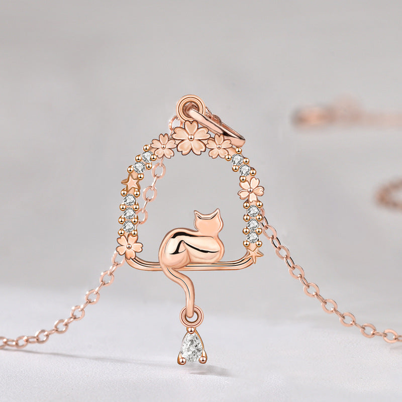 Origsoul rose gold cat necklace with floral and crystal accents and delicate chain