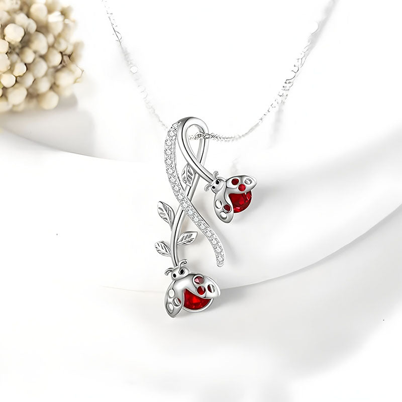 S925 ladybug vine necklace featuring silver vine design and vibrant red ladybug accents