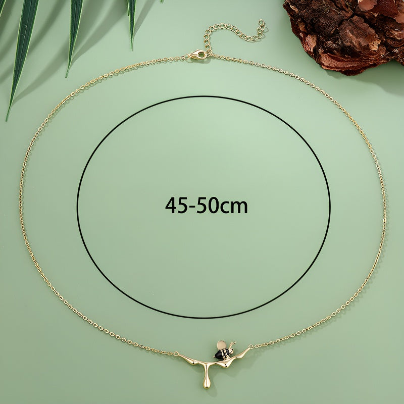 Origsoul S925 sterling silver bee necklace displayed with a 45-50cm length option on a green background