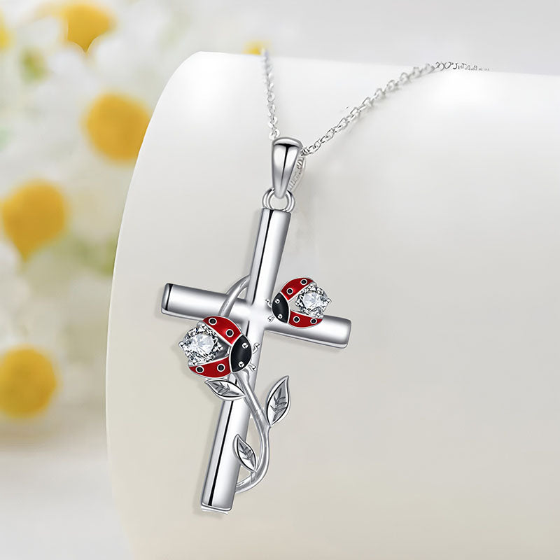 S925 sterling silver ladybug cross necklace featuring vibrant ladybugs and sparkling accents