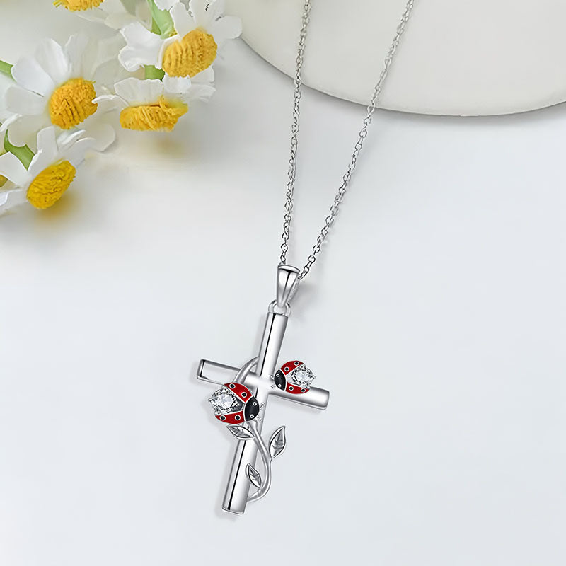 S925 sterling silver ladybug cross necklace with intricate detailing and floral accents
