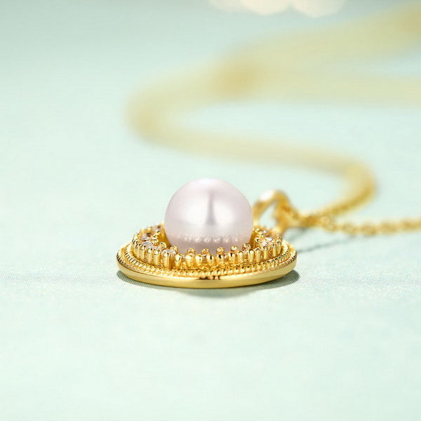 Origsoul freshwater pearl necklace with gold pendant and intricate detailing on delicate chain