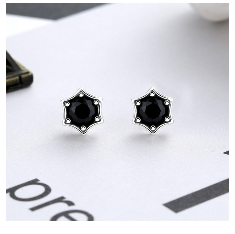 Origsoul cosmic star stud earrings with black gemstone center in silver star-shaped setting