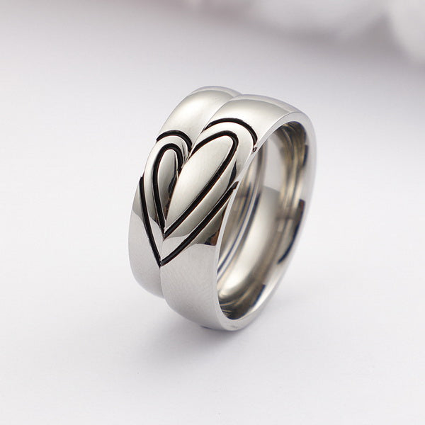 Origsoul silver heart shaped couple rings with engraved black heart design on white background