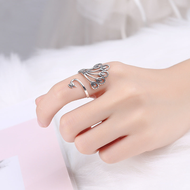 Origsoul peacock adjustable ring for women in silver worn on hand with detailed feather design