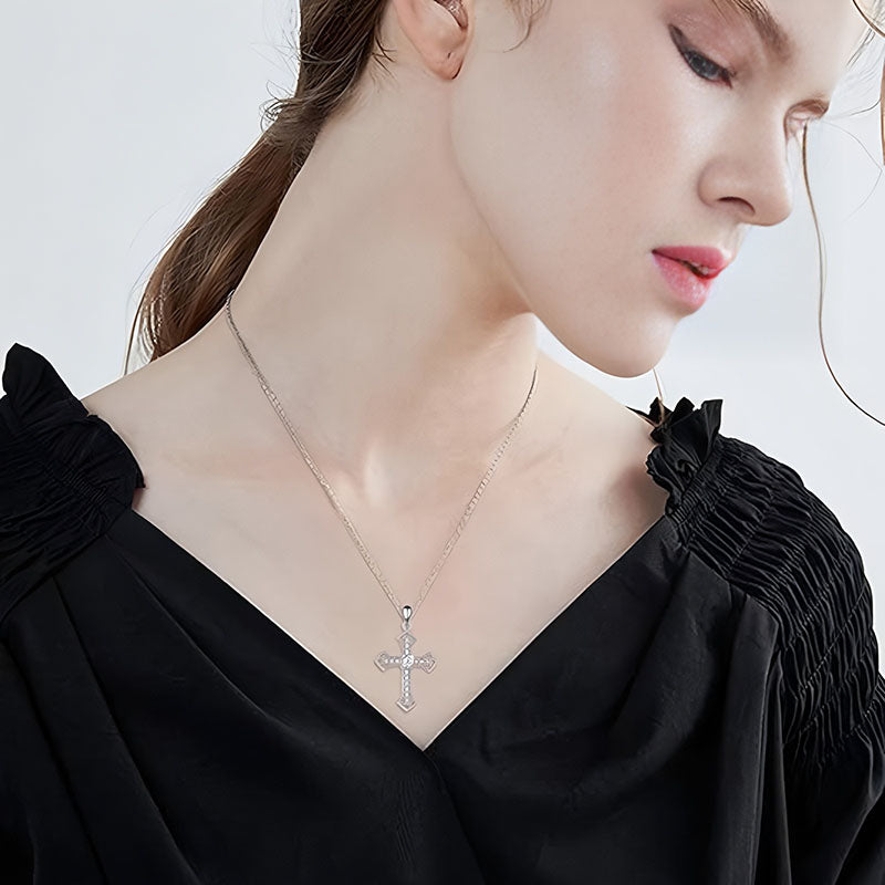 Origsoul sparkling cross pendant necklace worn by woman in black top with detailed chain