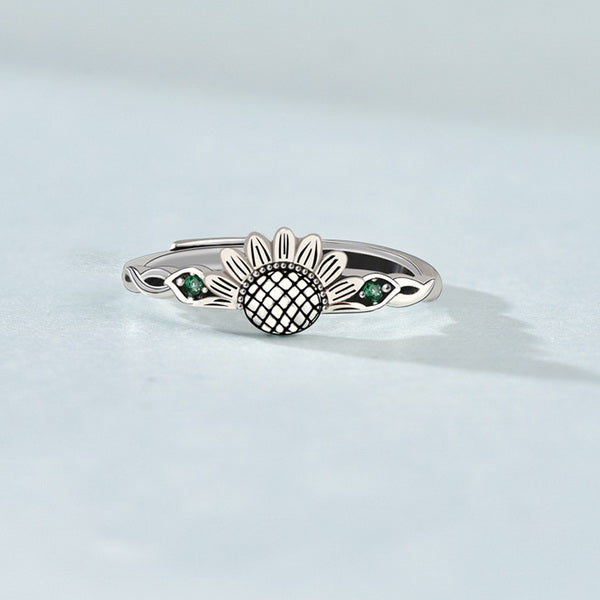 Origsoul sunflower antique ring in silver with green gemstone accents on a delicate band