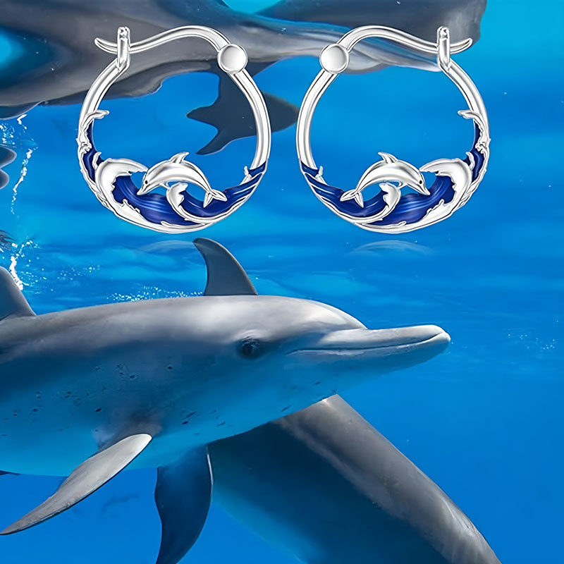 Sterling silver dolphin earrings with blue wave design showcasing playful dolphins
