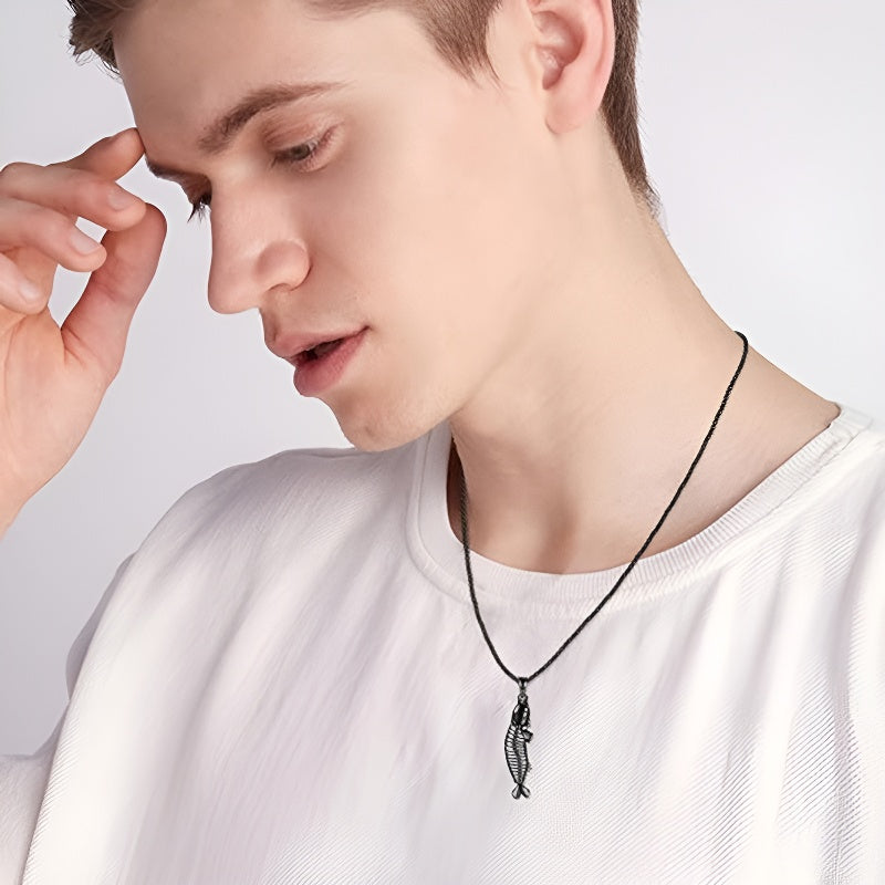 Origsoul sterling silver fishbone necklace worn by a man with a casual look