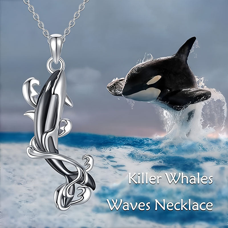 Sterling silver killer whale necklace with a sleek design showcasing orca movement and ocean waves