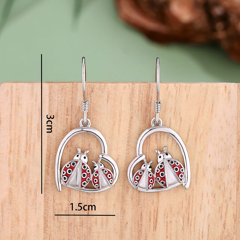 Origsoul sterling silver ladybug earrings with red detailing and heart-shaped design for nature lovers