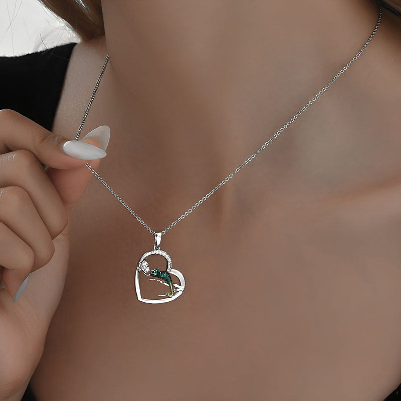 Origsoul sterling silver lizard heart necklace with green accents and elegant design worn on a model