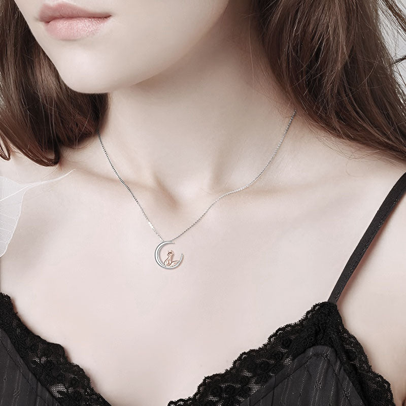 Sterling silver moon fox necklace featuring a delicate design worn by a model