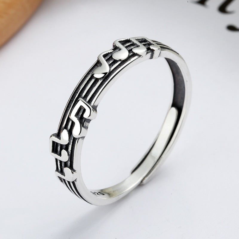 Origsoul silver music note eternity ring featuring detailed musical notes on band